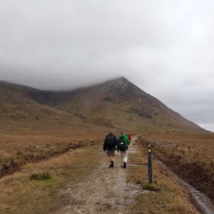 Two hikers follow a trail in Ireland