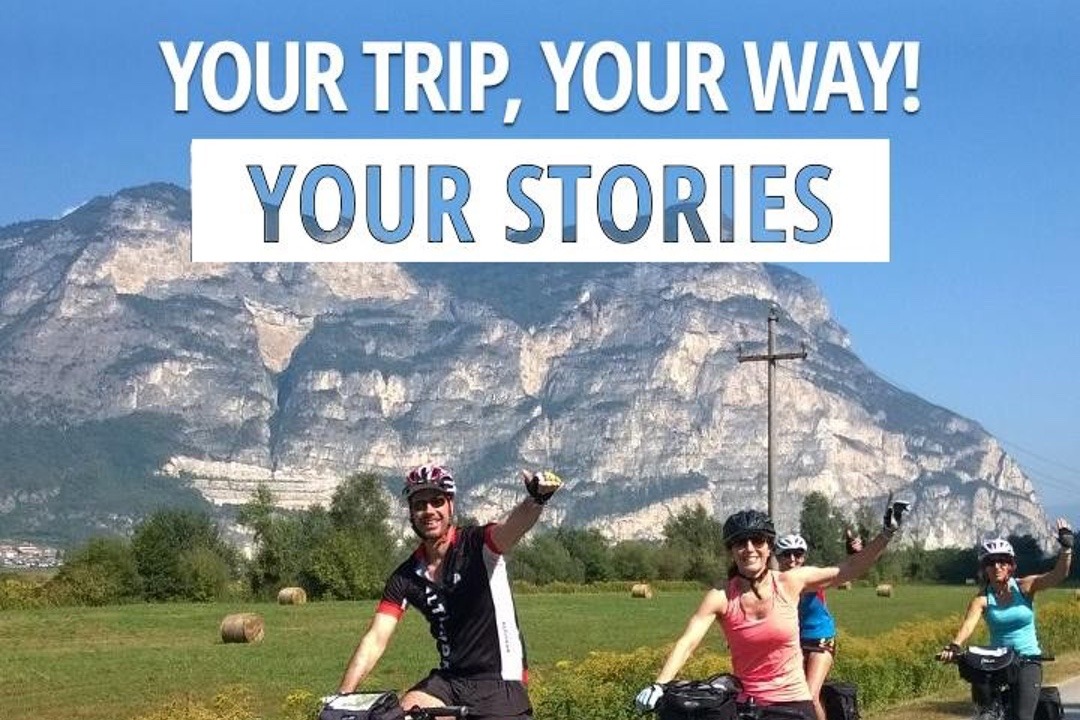 Cyclists waving beneath the caption "Your Trip, Your Way!"
