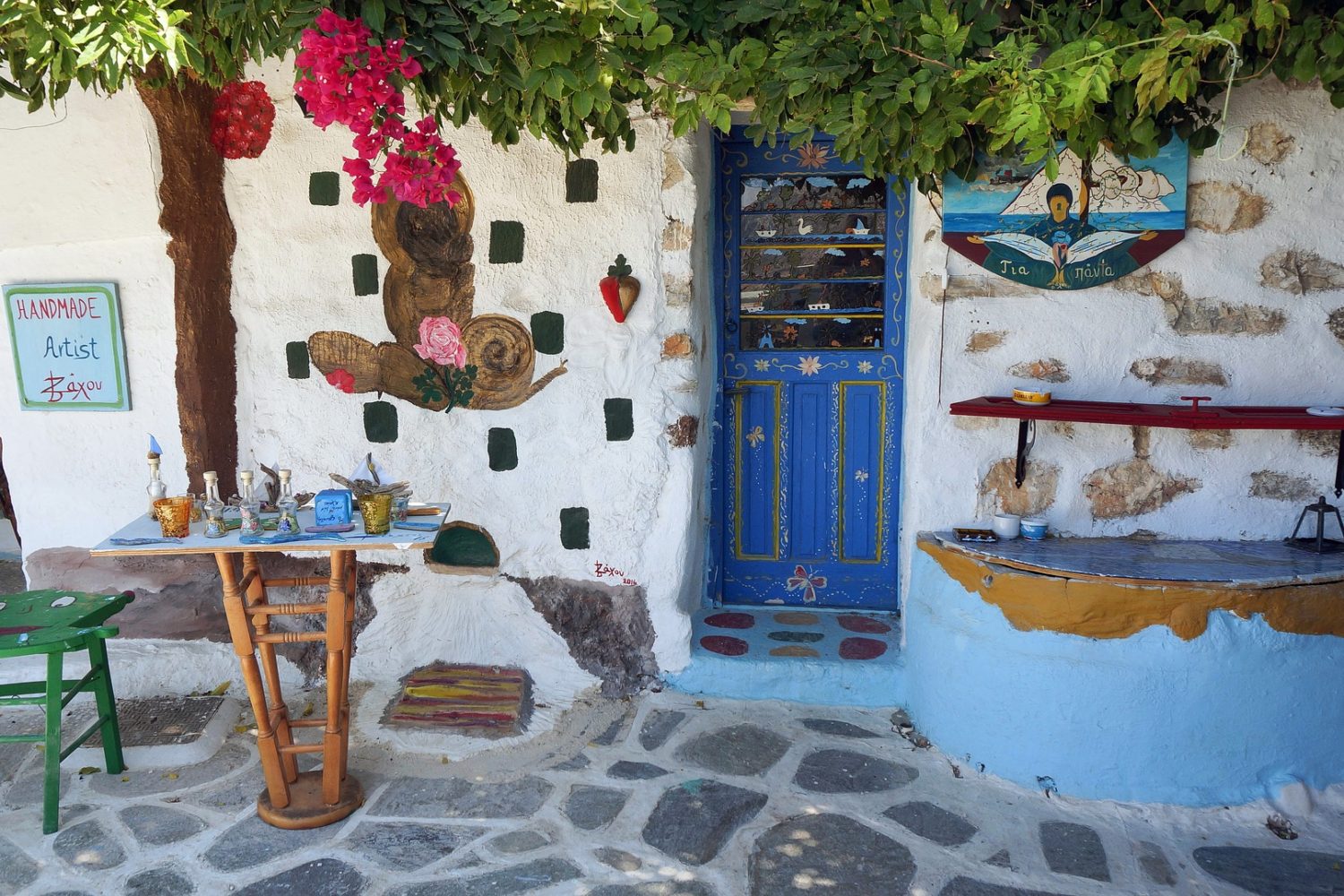 Colorful shop fronts and handicrafts in Amorgos, Greece.