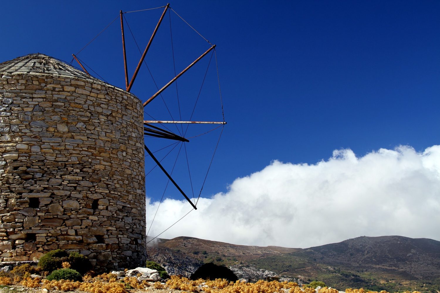 Old windmills still dot the hillsides in Naxos, Greece.